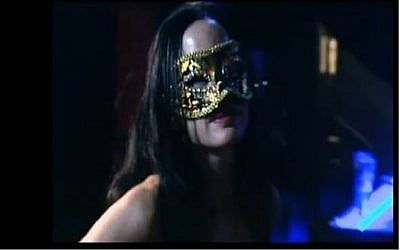 The unnamed sports teacher as she appeared in a reality show as an S&M mistress. (screen capture: HOT)