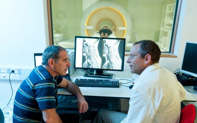 Alon Friedman (left) and Ilan Shelef with the MRI machine on Sunday (photo credit: courtesy of Dani Machlis/BGU)