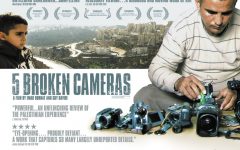 Emad Burnat and one of his sons in the movie poster for '5 Broken Cameras' (Courtesy '5 Broken Cameras')