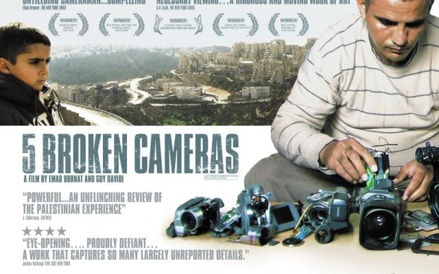 Emad Burnat and one of his sons in the movie poster for '5 Broken Cameras' (Courtesy '5 Broken Cameras') Emad Burnat and one of his sons in the movie poster for '5 Broken Cameras' (Courtesy '5 Broken Cameras')