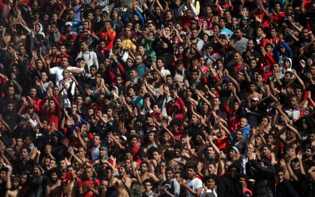 Egyptian soccer fans of the Al-Ahly club celebrate a court verdict that returned 21 death penalties in last year's soccer violence which left 74 dead, inside the club premises in Cairo, Egypt, Saturday, January 26, 2013 (photo credit: AP/Khalil Hamra) Egyptian soccer fans of the Al-Ahly club celebrate a court verdict that returned 21 death penalties in last year's soccer violence which left 74 dead, inside the club premises in Cairo, Egypt, Saturday, January 26, 2013 (photo credit: AP/Khalil Hamra)