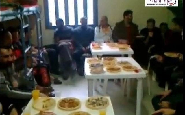 Palestinian security prisoners hold an engagement party in prison. (screen capture: Youtube/HakolHayehudi) Palestinian security prisoners hold an engagement party in prison. (screen capture: Youtube/HakolHayehudi)