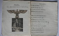 Feuchtwanger was forced to include Nazi iconography in his school notebooks -- including, in this case, a photo of his famous neighbor. (Courtesy of Editions Michel Lafon)