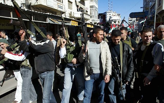 Palestinian President Mahmoud Abbas supporters of the Al-Aqsa Brigades rally in the West Bank town of Ramallah, December 17, 2006. (photo credit: Ahmad Gharabli/Flash90)