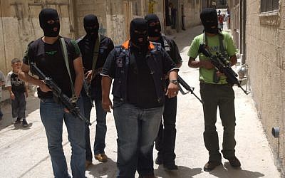 Masked members of Fatah's military branch patrol the streets in 2007. (photo credit: Wagdi Ashtiyeh/Flash90) Masked members of Fatah's military branch patrol the streets in 2007. (photo credit: Wagdi Ashtiyeh/Flash90)