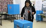 An Arab Israeli woman casts her vote at a polling station in the Arab village of Abu Ghosh in 2009. (photo credit: Nati Shohat/Flash90)
