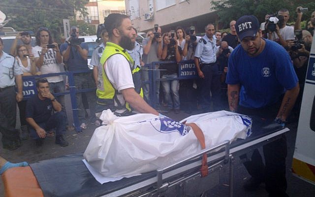 The body of one of Michal Aloni's daughters is brought out of her Ra'anana home, November 2010 (photo credit: Flash90)