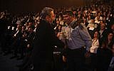 Lt. Gen. (res) Gabi Ashkenazi shaking Barak's hand with visible discomfort on his last day in uniform (Photo credit: Michael Shvadron: IDF Spokesperson's Office/ Flash 90)