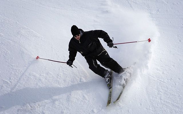 An skier on Mount Hermon after snowstorm in early January. Snow is still on the slopes and the site director expects a lot of Israelis to visit for Election Day on Tuesday. (photo credit: Yaakov Naumi/Flash90).