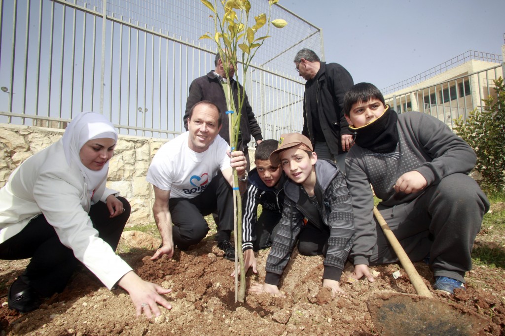 Mayor Nir Barkat plays with children during a visit to a school in the city's Arab Zur Baher neighborhood last year (Photo credit: Uri Lenz/Flash90) Mayor Nir Barkat plays with children during a visit to a school in the city's Arab Zur Baher neighborhood last year (Photo credit: Uri Lenz/Flash90)