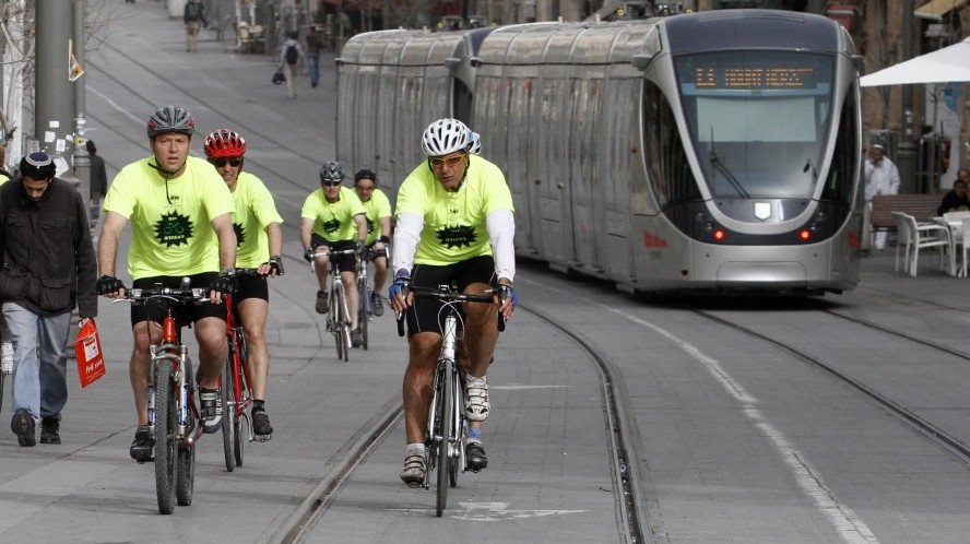 Nir Barkat rides his bicycle down Jaffa Road, with the light rail in the background. (photo credit: Uri Lenz/Flash90) Nir Barkat rides his bicycle down Jaffa Road, with the light rail in the background. (photo credit: Uri Lenz/Flash90)