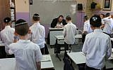 Illustrative photo: Young ultra-Orthodox students pray in their classroom (photo credit: Nati Shohat/Flash90)