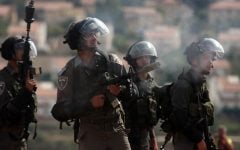 An Israeli soldier firing a tear gas cannister during a demonstration in the West Bank in October 2012. (photo credit: Issam Rimawi/Flash90)
