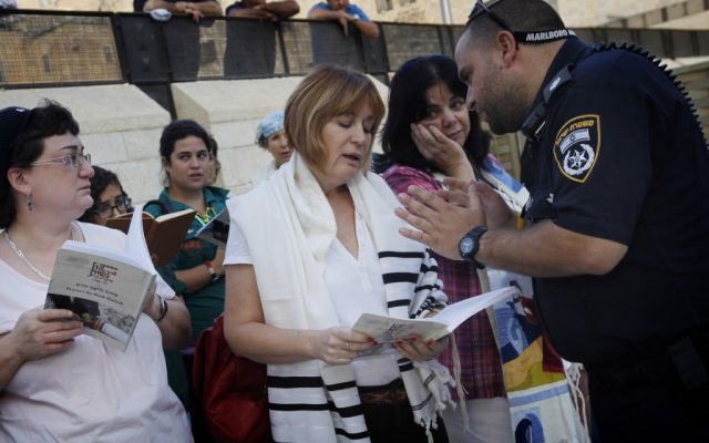 Lesley Sachs, director of 'Women of the Wall,' is confronted by police for wearing a 'tallit' (prayer shawl) at the Western Wall last October (Photo credit: Miriam Alster/FLASH90) Lesley Sachs, director of 'Women of the Wall,' is confronted by police for wearing a 'tallit' (prayer shawl) at the Western Wall last October (Photo credit: Miriam Alster/FLASH90)