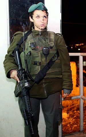 An Israeli border police officer after she shot and killed an armed man in Hebron, December 12, 2012. (photo credit: Oren Nachshon/Flash90)