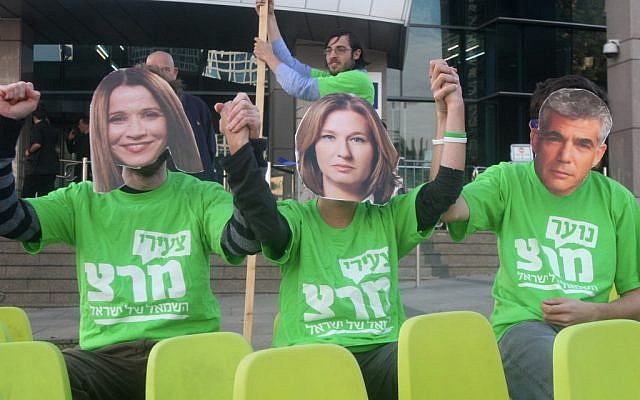 Meretz supporters wear masks depicting Shelly Yachimovich, Tzipi Livni and Yair Lapid, as they their possible entry to a Netanyahu government, December 17, 2012. (photo credit: Roni Schutzer/Flash90) Meretz supporters wear masks depicting Shelly Yachimovich, Tzipi Livni and Yair Lapid, as they their possible entry to a Netanyahu government, December 17, 2012. (photo credit: Roni Schutzer/Flash90)