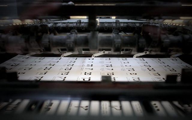 Sheets of newly printed ballots in preparation for Israel's upcoming January 22 national elections, at a warehouse in Jerusalem, January 02, 2013. (photo credit: Yoav Ari Dudkevitch/Flash90)