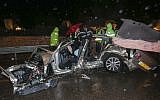 Police officers investigate the scene of a car accident on the Jerusalem-Tel Aviv Highway, in which three men were killed on Monday, January 7. (photo credit: Flash90)