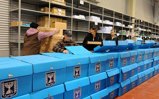 Workers prepare ballot boxes for the upcoming Israeli election at a warehouse near Tel Aviv before they are shipped to polling stations, January 2013. (photo credit: Yossi Zeliger/Flash90)