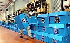 A worker prepares ballot boxes for the previous elections, at a warehouse in Shoham, near Tel Aviv, January 8, 2013 (photo credit: Yossi Zeliger/Flash90)