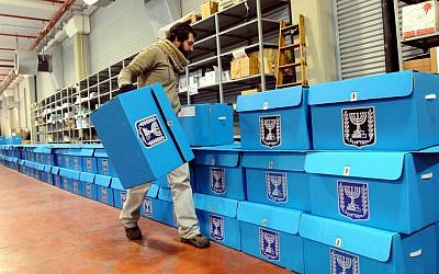 A worker prepares ballot boxes for the previous elections, at a warehouse in Shoham, near Tel Aviv, January 8, 2013 (photo credit: Yossi Zeliger/Flash90)