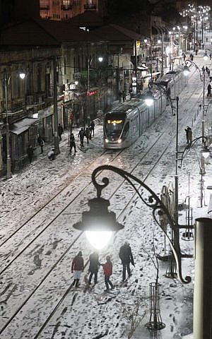 Jerusalem's snowy light rail Wednesday night (photo credit: Miriam Alster/Flash90)