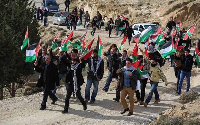 Palestinian activists marching to set up the Bab el-Shams outpost on Friday. (photo credit: Flash90) Palestinian activists marching to set up the Bab el-Shams outpost on Friday. (photo credit: Flash90)