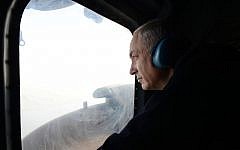 Prime Minister Benjamin Netanyahu looks down on Israel's north during a helicopter ride, January 13, 2013 (photo credit: Kobi Gideon/GPO/Flash90)