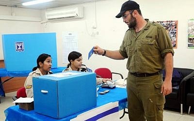 An Israeli soldier voting at a Navy base in Ashdod (Photo credit: Yossi Zeliger/FLASH90) An Israeli soldier voting at a Navy base in Ashdod (Photo credit: Yossi Zeliger/FLASH90)