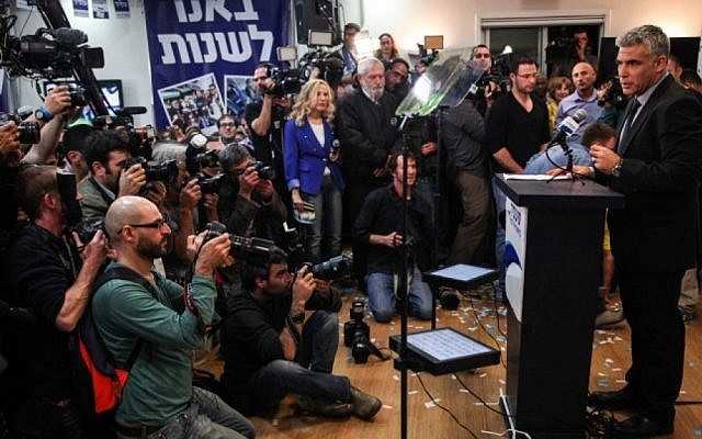 Yesh Atid leader Yair Lapid speaks to reporters after results revealed him to be the big winner of the elections on Tuesday, Jan. 22 (Avishag Shaar Yashuv/Flash90) Yesh Atid leader Yair Lapid speaks to reporters after results revealed him to be the big winner of the elections on Tuesday, Jan. 22 (Avishag Shaar Yashuv/Flash90)