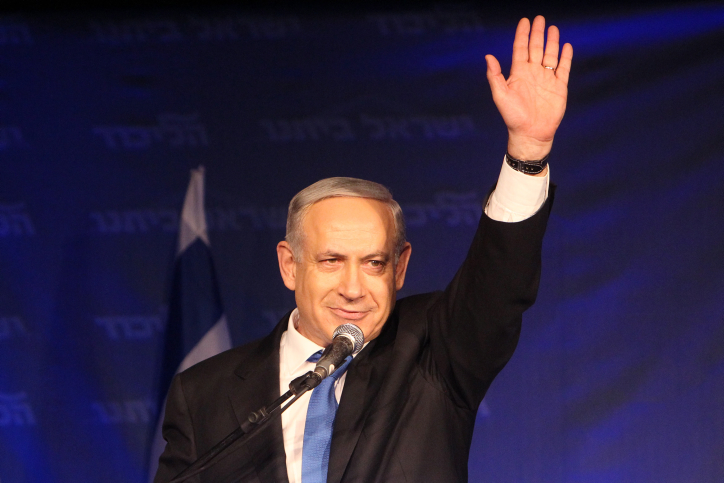 Prime Minister Benjamin Netanyahu waves to supporters after initial election results early Wednesday showed the Likud-Beytenu heading for a victory, albeit with a much-reduced number of Knesset seats (photo credit: Miriam Alster/Flash90) Prime Minister Benjamin Netanyahu waves to supporters after initial election results early Wednesday showed the Likud-Beytenu heading for a victory, albeit with a much-reduced number of Knesset seats (photo credit: Miriam Alster/Flash90)