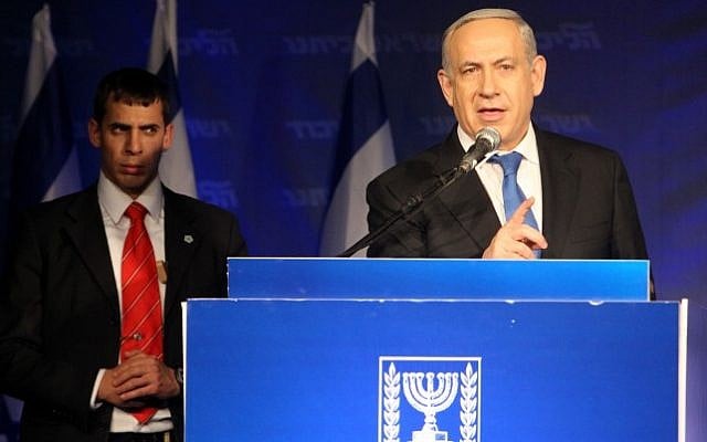 Prime Minister Benjamin Netanyahu seen addressing supporters at the Tel Aviv Fairgrounds on Tuesday night after election day (photo credit: Miriam Alster/Flash90)
