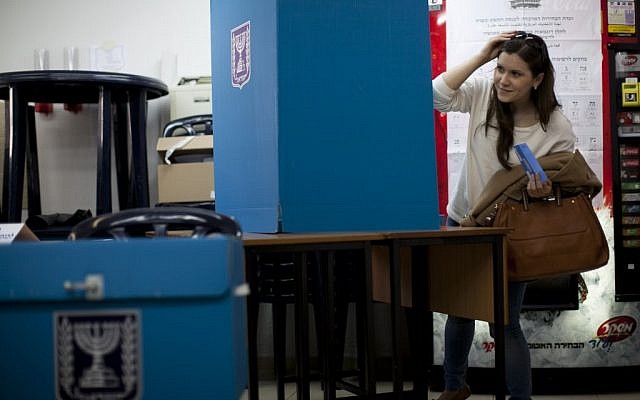 A woman casting a ballot. (photo credit: Yonatan Sindel/Flash90) A woman casting a ballot. (photo credit: Yonatan Sindel/Flash90)