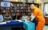 A prisoner casts his ballot at Rimonim prison near Ra'anana in central Israel on January 22, 2013. (photo credit: Yossi Zeliger/Flash90)