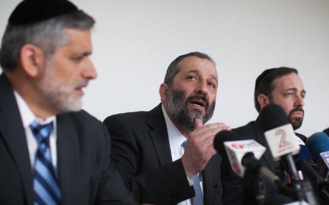 Shas co-leaders Ariel Atias (right), Aryeh Deri (center) and Eli Yishai address the party on January 27. (photo credit: Yonatan Sindel/Flash90