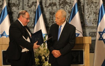 Central Elections Committee chairman Judge Elyakim Rubinsten hands the general elections results to President Shimon Peres on January 30. (photo credit: Miriam Alster/Flash90)