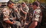 This picture released by the French Army Communications Audiovisual office (ECPAD) shows French soldiers getting ready before boarding to Bamako, the capital from Mali, at Kossei camp in N'Djamena, Chad, Friday, Jan. 11, 2013.  (Photo credit: AP/R.Nicolas-Nelson ECPAD)