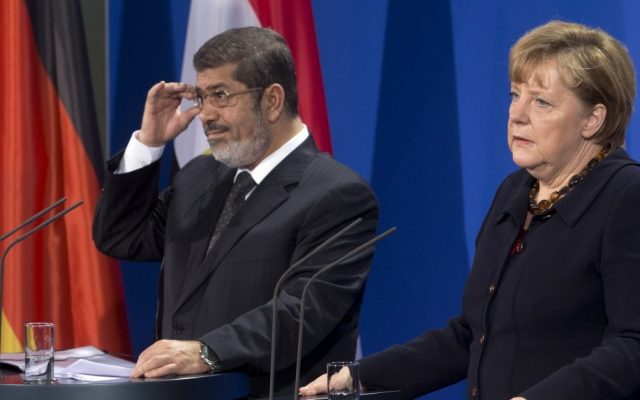German Chancellor Angela Merkel, and President of Egypt Mohammed Morsi,  address the media during a joint press conference after a meeting at the chancellery in Berlin, Germany, Wednesday, Jan. 30, 2013. (photo credit: AP/Michael Sohn)