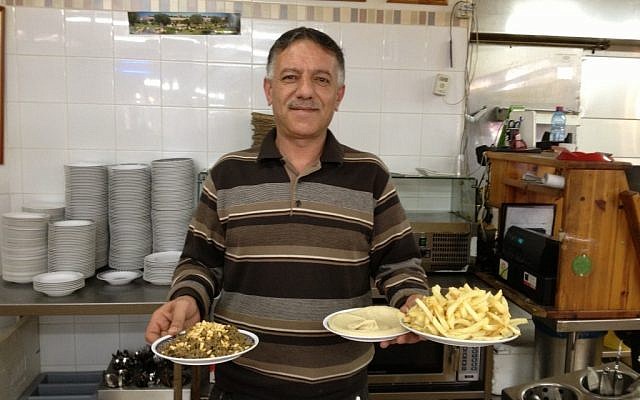A waiter at the Lebanese restaurant in Abu-Ghosh (photo credit: Elhanan Miller/Times of Israel) A waiter at the Lebanese restaurant in Abu-Ghosh (photo credit: Elhanan Miller/Times of Israel)