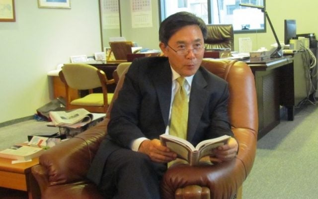 South Korea's ambassador to Israel, Kim il-soo, holding an abridged version of the Talmud in his Herzliya office (photo credit: courtesy South Korean embassy in Israel)