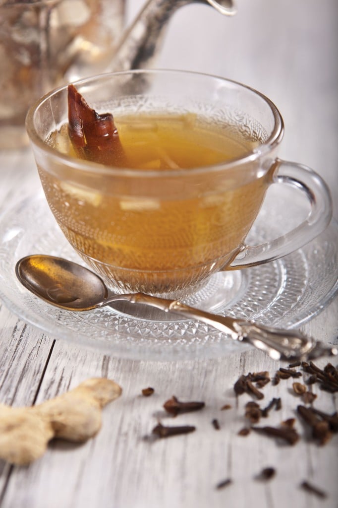 A glass of hot piping apple chai, served with a stick of cinnamon or carob, for Tu B'shvat (Courtesy Phyllis Glazer)