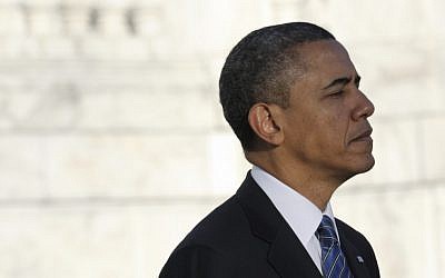 US President Barack Obama pauses after placing a wreath at Arlington Cemetery on Sunday, January 20, 2013. (photo credit: AP/Susan Walsh)
