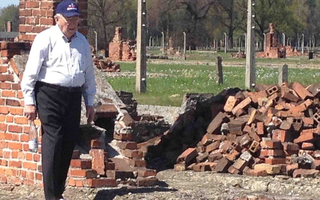 Now 87, Israel "Izzy" Arbeiter visits Auschwitz, which he survived as a young man while cleaning latrines. (Courtesy of the WWII Foundation) Now 87, Israel "Izzy" Arbeiter visits Auschwitz, which he survived as a young man while cleaning latrines. (Courtesy of the WWII Foundation)