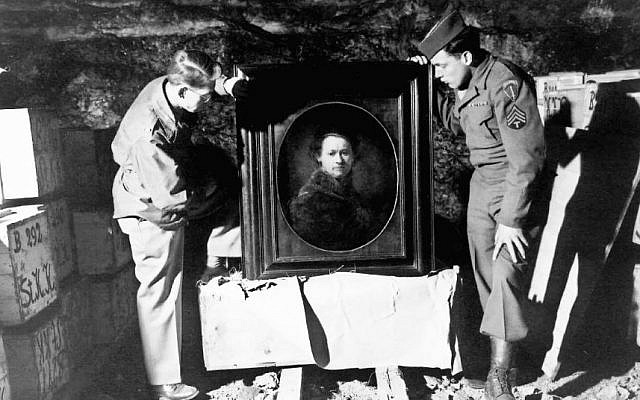 Two US soldiers, shown in 1945 or 1946 inspecting a Rembrandt self-portrait in a salt mine where the Nazis stored stolen and hidden art (Courtesy National Archives and Records Administration) Two US soldiers, shown in 1945 or 1946 inspecting a Rembrandt self-portrait in a salt mine where the Nazis stored stolen and hidden art (Courtesy National Archives and Records Administration)