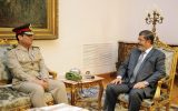 Egyptian Defense Minister Lt. Gen. Abdel-Fattah el-Sissi meets with Egyptian President Mohammed Morsi in Cairo, Egypt, in August 2012. (photo credit: AP/Egyptian Presidency/File)