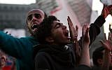 Egyptian protesters chant slogans as thousands of soccer fans of Egypt's most popular team, Al-Ahly, rally in Tahrir Square, the focal point of the Egyptian uprising, in Cairo, Egypt, Friday, Jan. 18, 2013. Fans called for revenge a week before the court was expected to give its verdict over last year's Port Said football stadium disaster, which killed 74 fans. (Photo credit: AP/Khalil Hamra)