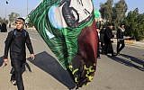 Shiite pilgrims march on their way to Karbala for Arbaeen in Baghdad, Iraq, Monday, Dec. 31, 2012 (photo credit: AP/Karim Kadim)