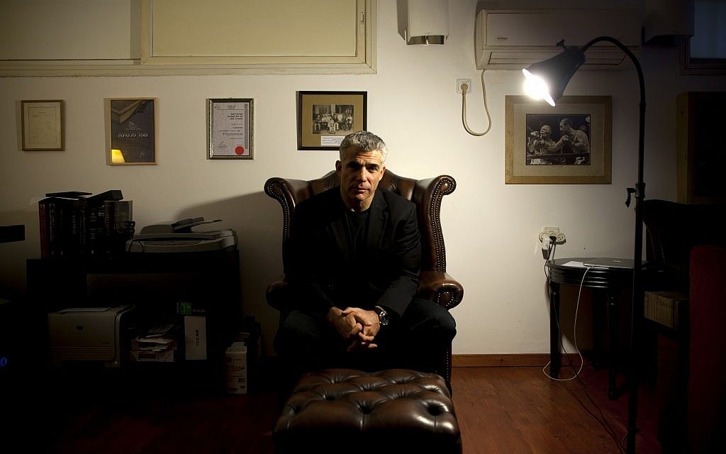 Yair Lapid in his home this week. (photo credit: AP/Oded Balilty) Yair Lapid in his home this week. (photo credit: AP/Oded Balilty)
