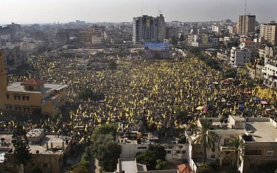 Tens of thousands of Fatah supporters rallying in Gaza City Friday. (photo credit: AP/Adel Hana)
