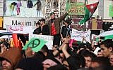 Demonstrators wave the Jordanian flag during a protest by the Muslim Brotherhood movement and other opposition parties against the upcoming parliamentary elections, in Amman, Jordan, Friday, Jan. 18, 2013. (Photo credit: AP/Mohammad Hannon)